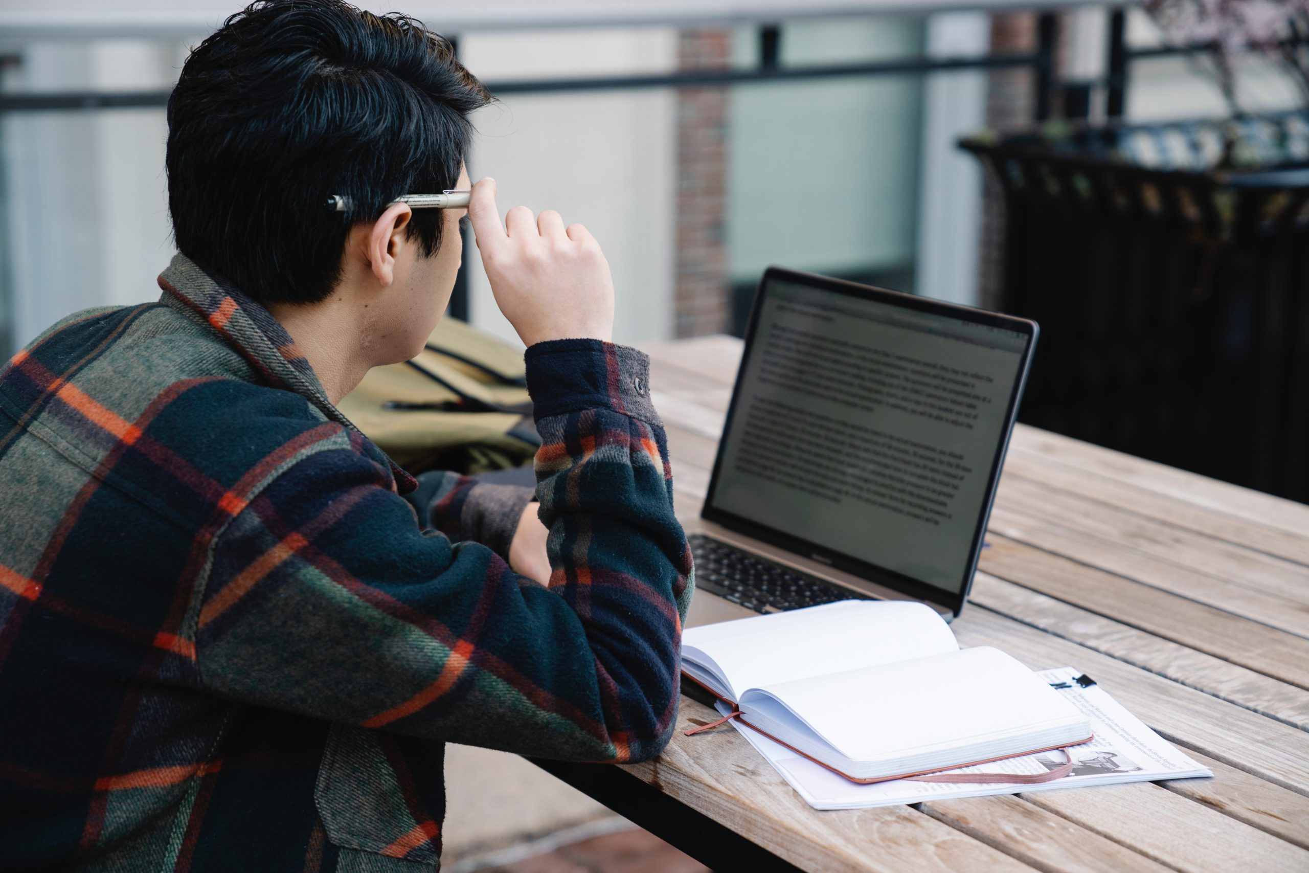 man reading laptop